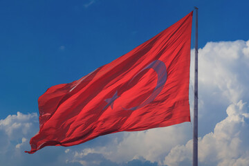 Turkish flag, on a red background white star and moon. Turkish flag flies in the wind.