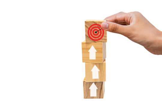 Place wooden blocks as a step towards the goal on wooden table. Business ideas for successful growth process.PNG