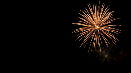 Fototapeta premium A fireworks display lighting up the night sky, summer, fireworks, hd, spectacular with copy space