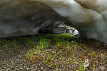 rest from avalanche, snow melting in the Alps of Vorarlberg make tunnel in the avalanche, snow on...