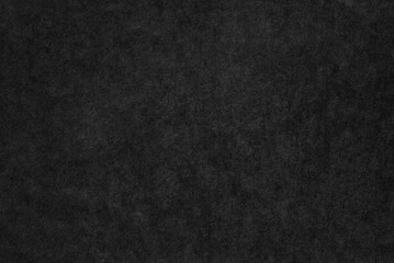 A sheet of black cardboard texture as background