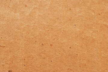 A sheet of brown recycled cardboard texture as background	