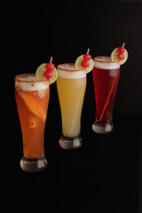 micheladas cocktail with strawberry and lime