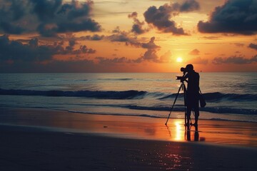 Photographer captures sunrise on beach with camera and tripod.