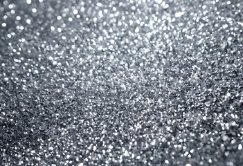 Obraz premium Sparkling silver glitter texture with a soft bokeh effect. Perfect for backgrounds, overlays, or adding a touch of glamour and shine to designs.