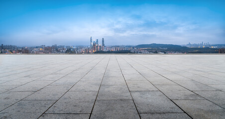 Urban Skyline and Empty Plaza Under Clear Sky