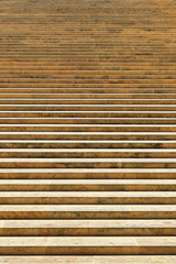 Stone steps in the historic district of a city. No people.