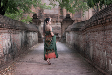 women in traditional clothing on historical on background. Portrait women in traditional clothing , Thai traditional in Ayutthaya, Thailand.