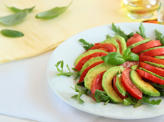 healthy eating avocado with tomatoes and basil