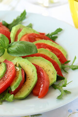 healthy eating avocado with tomatoes and basil