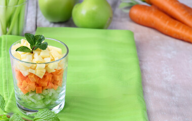 vegetables and fruits chopped for snacks in a glass