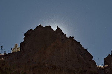 Russia. The North Caucasus. Glowing fluff of flying seeds of Alpine grasses in the glare of...