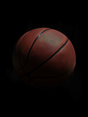 Obraz premium Closeup of a basketball isolated on black background. Vertical shot. Generative AI.