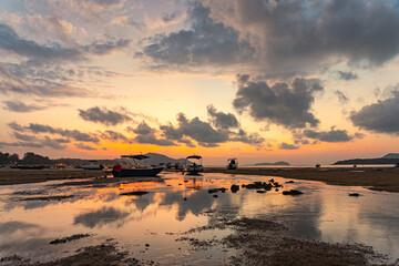 sweet sky cloudscape in sunrise at Rawai beach Phuket. colorful light through to the cloud above the ocean. Scene of Colorful romantic sky sunset background. sweet sky cover the sea background..