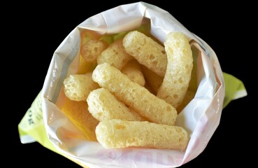 corn sticks in a plastic bag on a black table