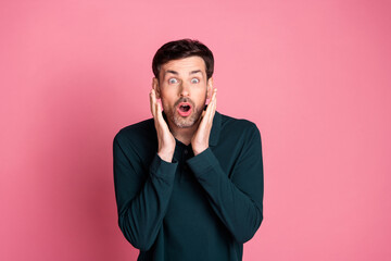 Portrait of nice young man cant believe wear pullover isolated on pink color background