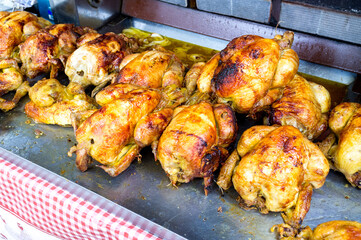 delicious and freshly cooked grilled chickens at a street market in Montpellier France