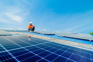 engineer man inspects construction of solar cell panel or photovoltaic cell by electronic device....