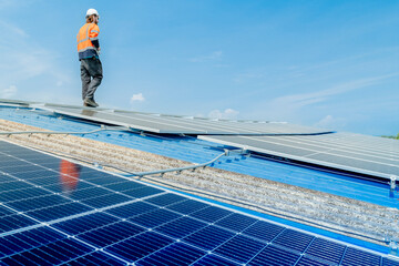engineer man inspects construction of solar cell panel or photovoltaic cell by electronic device....