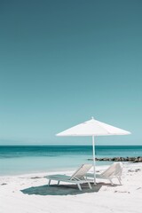 Summer concept of umbrella and chair with tropical sea and beach.