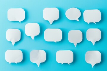 Simple set of white speech bubbles on blue background