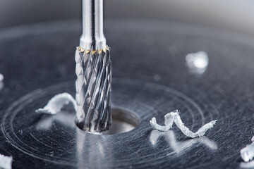Milling cutter make sink in hole in steel billet. Locksmith work.