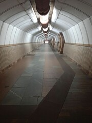 Railway underground tunnel which install running and conductor rail. Selective focus.