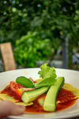 Pasta dish with fresh tomatoes and cucumbers, a tasty and healthy meal option