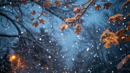 Snowflakes gently fall through the branches of a tree with autumn leaves, creating a serene winter scene.