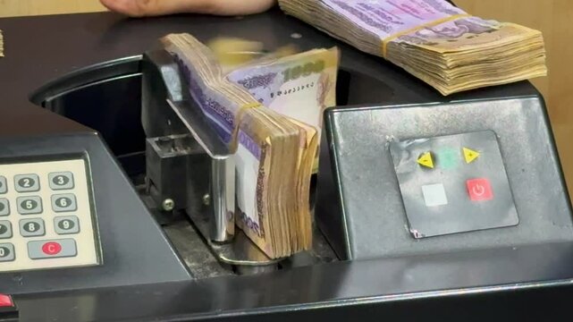 Close-Up Footage of Bangladeshi Taka Counting in Bank Money Machine. Bangladeshi Currency