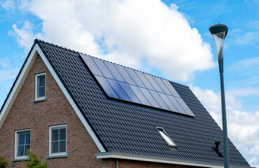 Fototapeta premium Solar Panel House Roof Generator Energy The Hague Netherlands Blue Sky Sun