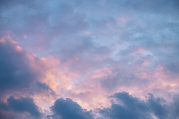 Beautiful clouds in the sky at sunset, pink and blue, natural background, romance, magic