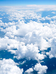 Landscape of beautiful fluffy puffy white cumulus clouds on blue sky background, top view