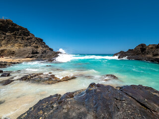 Halona Hawaii Beach Cove and the view to the lava coast with deep blue Pacific Ocean waves