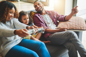 Home, relax and family on sofa, video game and bonding together with happiness, smile or break. Esports, excited or girl with mother, father or entertainment with competition or contest in lounge © ClearConcept/peopleimages.com