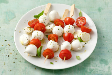 Caprese salad served on plate