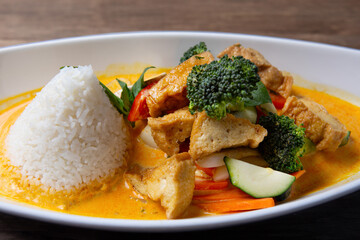 Asian fried tofu with vegetables, tofu and rice served on table 