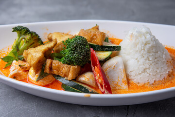 Asian fried tofu with vegetables, tofu and rice served on table 