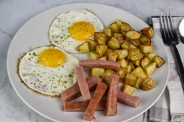 fried eggs top with herbs  served with  spam sticks