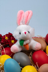 basket with straw and eggs decorated for the celebration of Christian Easter