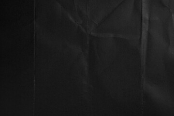 Cardboard sheet with black textured creased surface