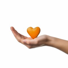 Obraz premium A hand gently cradles a small, orange heart. The heart is held in the palm of the hand, symbolizing love, care, and tenderness.