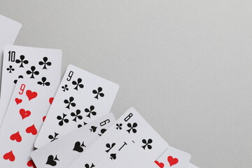 Playing cards on gray background, top view. Gambling concept