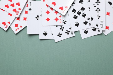 Playing cards on color background, top view. Gambling concept