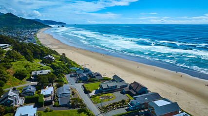 Naklejka premium Aerial View of Cannon Beach Haystack Rock and Coastal Town