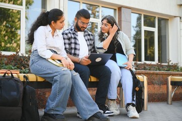 Cheerful Indian asian young group of college students or friends together