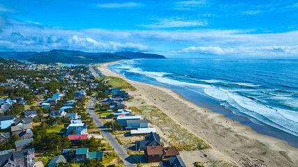 Aerial View of Pacific City Coastal Town and Beach Curve