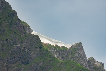 snow field in the mountain, Cornices, snowdrifts on the peak, overhanging snow cover is a danger of avalanches, possible snow falling down, snow could break off, danger in the alps of Austria