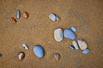 Serene Sandy Beach with Varied Stones Close-Up