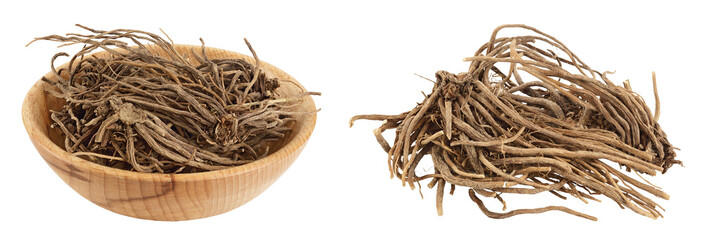 Dried Valerian root in wooden bowl isolated on white background. Valeriana officinalis with full depth of field.